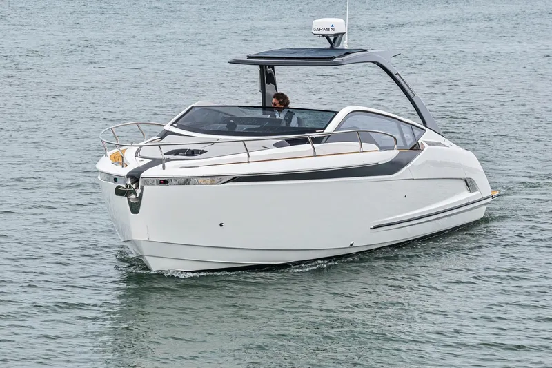 Slide: The Image of 2023 Fairline F//Line 33 Outboard cruising on open water. - 78