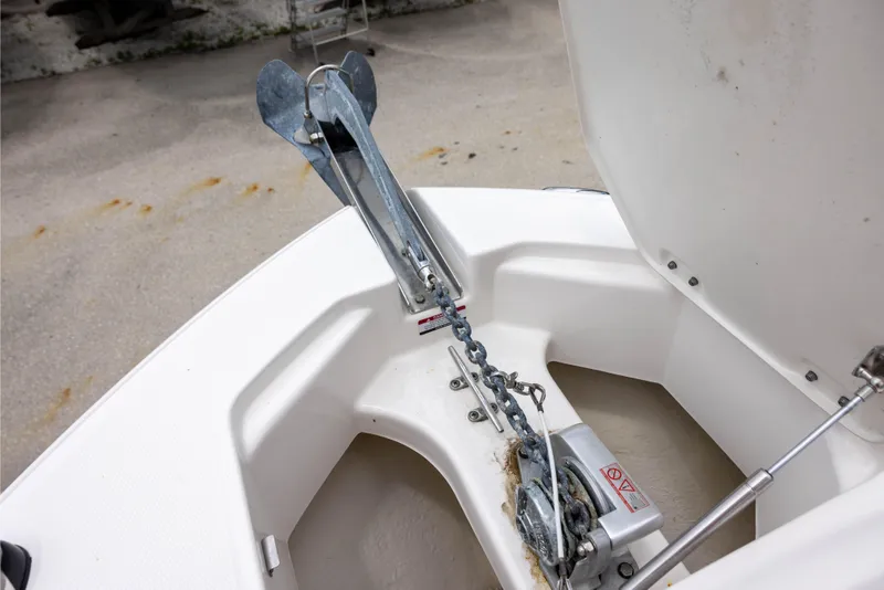Slide: The Image of Anchor compartment of 2018 Robalo R247 Dual Console boat. - 12