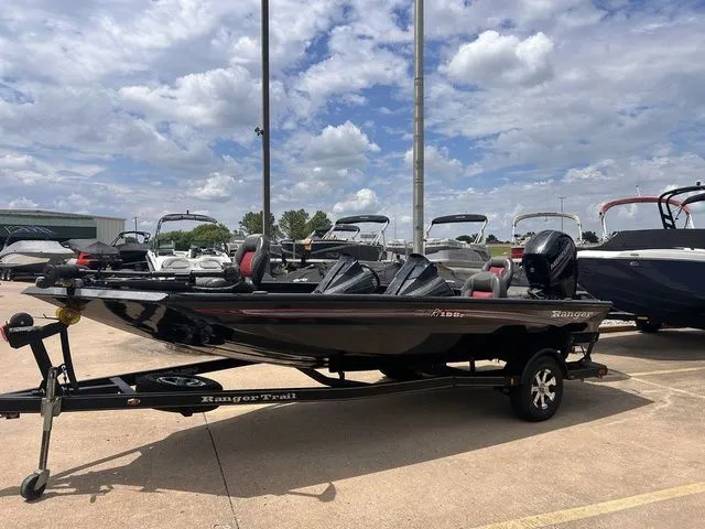 Slide: The Image of 2019 Ranger RT198P boat on trailer under cloudy sky. - 11