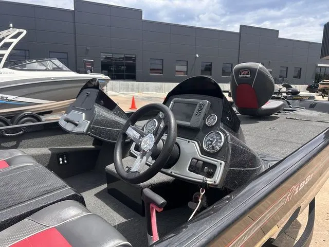 Slide: The Image of Interior view of a 2019 Ranger RT198P boat with steering console. - 5
