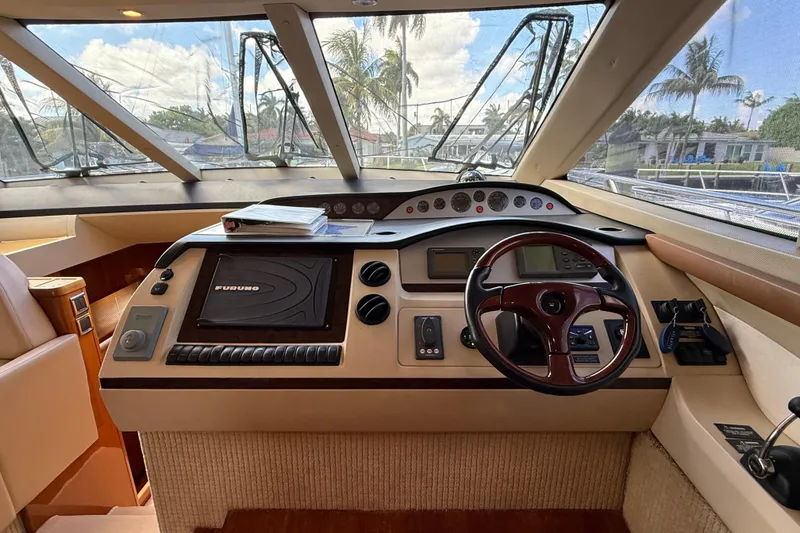 Slide: The Image of Helm of 2009 Princess 54 Flybridge yacht with navigation equipment and steering wheel. - 11