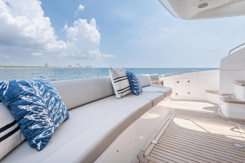 Slide: The Image of Luxurious 2009 Princess 54 Flybridge yacht deck with ocean view and plush seating. - 28