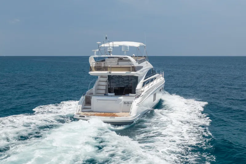 Slide: The Image of 2009 Princess 54 Flybridge yacht cruising on open sea. - 7