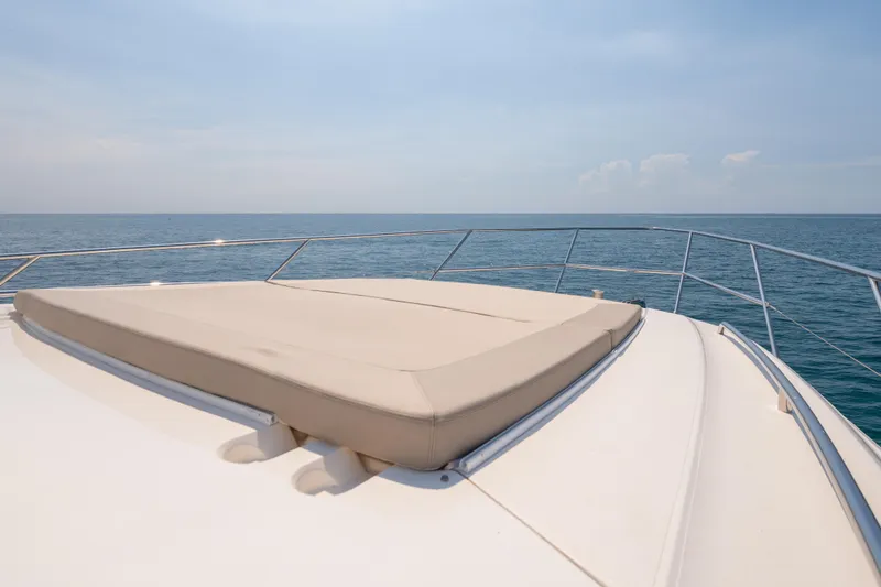 Slide: The Image of 2009 Princess 54 Flybridge yacht with sunpad, ocean view in background. - 30