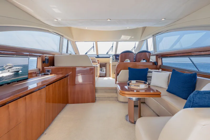Slide: The Image of Luxurious interior of 2009 Princess 54 Flybridge yacht with elegant seating and panoramic windows. - 38