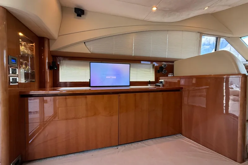 Slide: The Image of Luxurious interior of 2009 Princess 54 Flybridge yacht with sleek wood finish and modern amenities. - 7