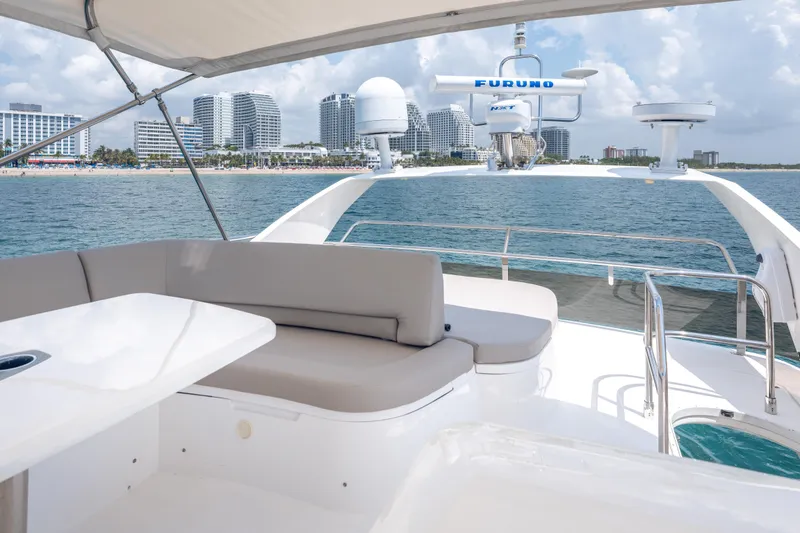 Slide: The Image of Luxurious 2009 Princess 54 Flybridge yacht with city skyline and ocean view. - 35