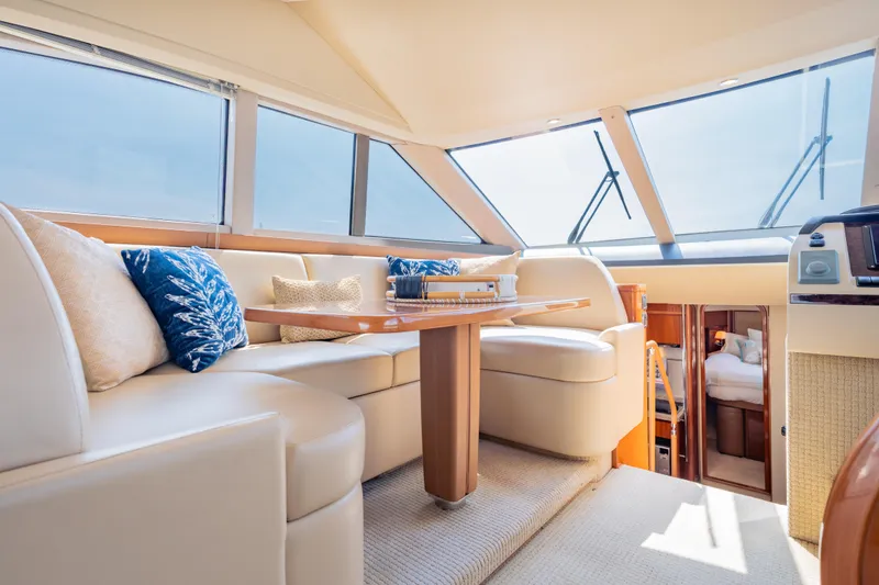 Slide: The Image of Luxurious interior of 2009 Princess 54 Flybridge yacht with elegant seating and panoramic windows. - 40