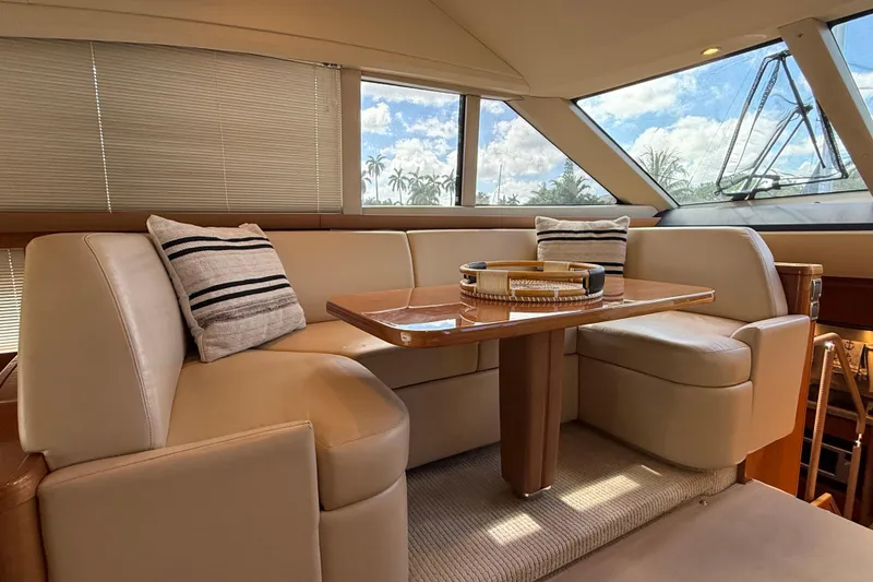 Slide: The Image of Luxurious interior of 2009 Princess 54 Flybridge yacht with plush seating and elegant decor. - 8