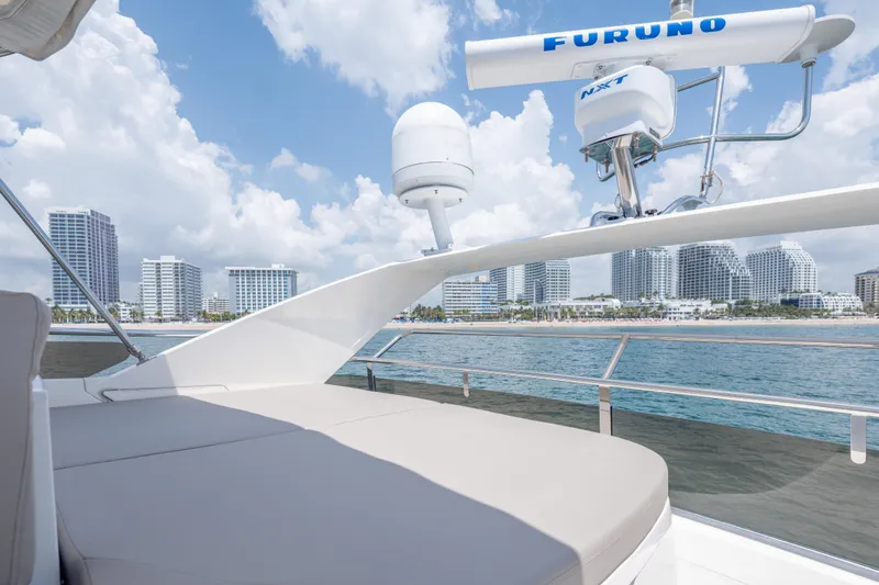 Slide: The Image of 2009 Princess 54 Flybridge yacht with city skyline and ocean view. - 37