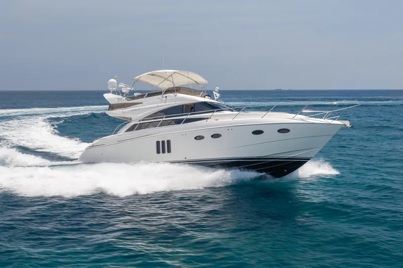 Slide: The Image of Luxury 2009 Princess 54 Flybridge yacht cruising on open sea. - 3