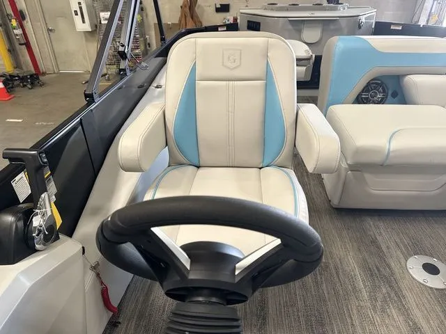 Slide: The Image of Interior of 2026 Godfrey Pontoons Sweetwater 2286 FS with steering wheel and seat. - 9