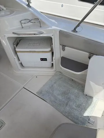 Slide: The Image of Interior of a 2002 Regal Commodore 2765 boat with cooler. - 10