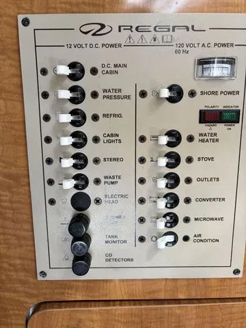 Slide: The Image of Regal Commodore 2765 2002 control panel with power switches. - 19