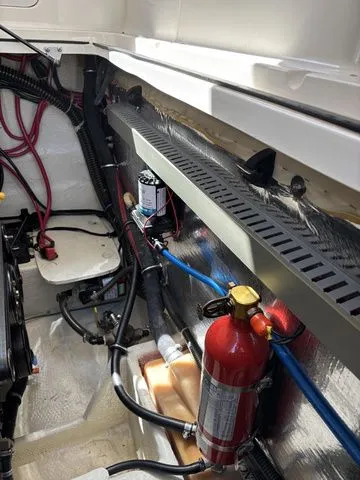 Slide: The Image of Engine compartment of 2002 Regal Commodore 2765 with fire extinguisher. - 28