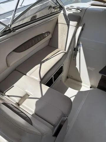 Slide: The Image of Interior of a 2002 Regal Commodore 2765 boat with beige seating. - 8