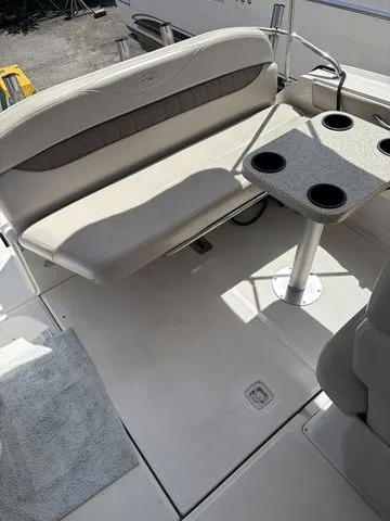 Slide: The Image of Interior of a 2002 Regal Commodore 2765 with bench seating and table. - 9