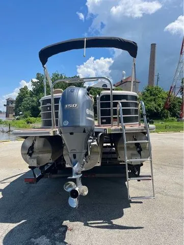 Slide: The Image of Rear view of a 2015 Berkshire 250E pontoon boat with outboard motor. - 3