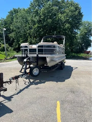 Slide: The Image of 2015 Berkshire 250E pontoon boat parked on trailer outdoors. - 4