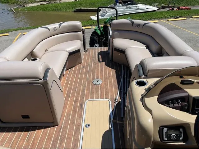 Slide: The Image of Interior of a 2015 Berkshire 250E pontoon boat with beige seating. - 6