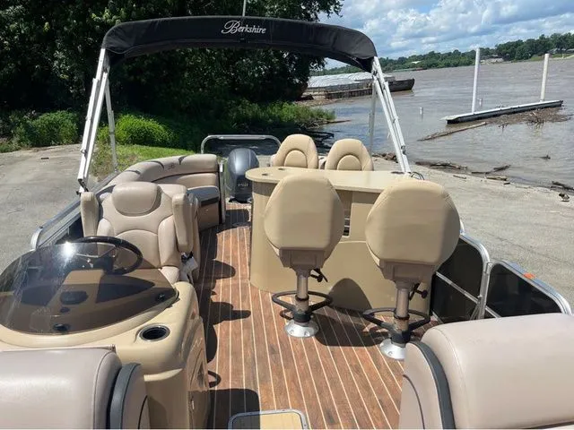 Slide: The Image of 2015 Berkshire 250E pontoon boat with seating by the riverside. - 8
