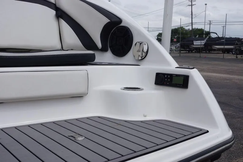 Slide: The Image of 2018 Yamaha Boats 242 Limited S interior with seating, speaker, and control panel. - 14