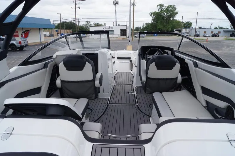 Slide: The Image of 2018 Yamaha Boats 242 Limited S interior with sleek seating and modern dashboard design. - 16
