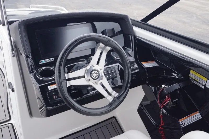 Slide: The Image of Steering console of 2018 Yamaha Boats 242 Limited S with modern controls and display. - 22