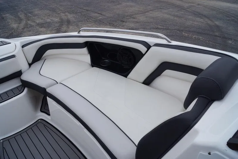 Slide: The Image of Interior seating of a 2018 Yamaha Boats 242 Limited S, featuring sleek white and black upholstery. - 23