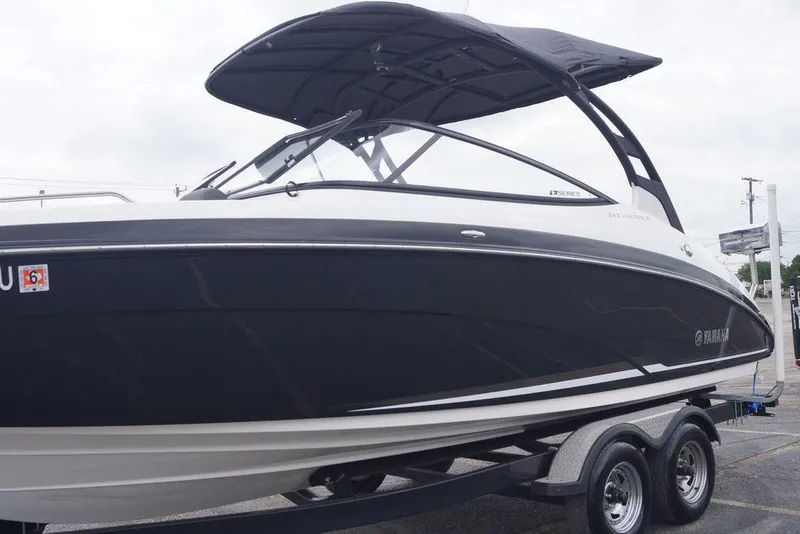 Slide: The Image of 2018 Yamaha Boats 242 Limited S, black and white, on trailer, side view. - 3