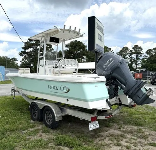 Slide: The Image of 2021 Robalo 226 Cayman boat on trailer, exterior view. - 2