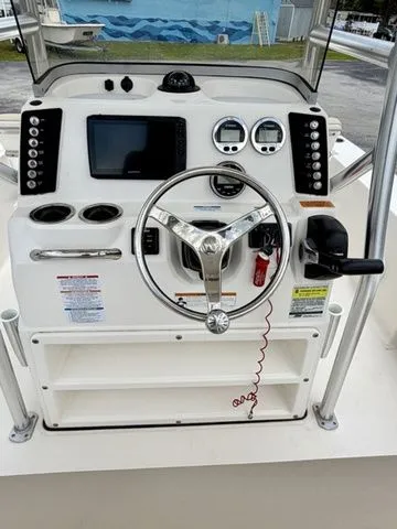 Slide: The Image of 2021 Robalo 226 Cayman helm with steering wheel and instruments. - 3