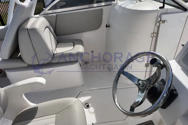 Slide: The Image of Interior of a 2022 Sea Fox 226 Traveler boat with helm and seating area. - 4