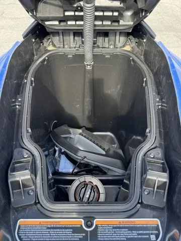 Slide: The Image of Open storage compartment of 2025 Sea-Doo Wake jet ski. - 16