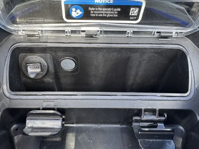 Slide: The Image of 2025 Sea-Doo Wake glove box with USB port. - 18