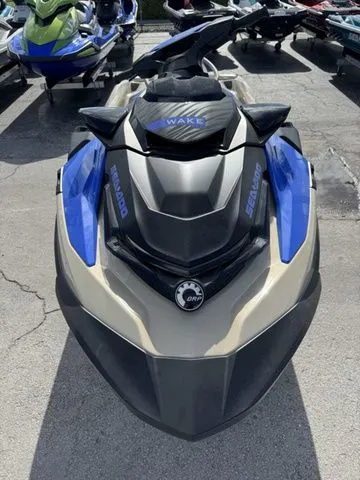 Slide: The Image of 2025 Sea-Doo Wake jet ski in blue and black on parking lot. - 3