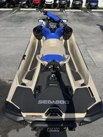 Slide: The Image of 2025 Sea-Doo Wake jet ski in blue and beige on parking lot. - 8