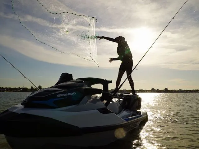 Slide: The Image of Person casting net from Sea-Doo FishPro Sport 170 on lake. - 3