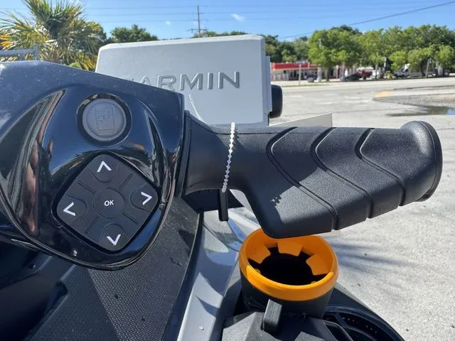 Slide: The Image of Close-up of Sea-Doo FISH PRO 2025 handlebar with Garmin display. - 16