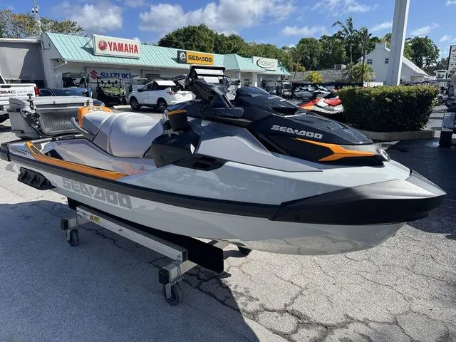 Slide: The Image of 2025 Sea-Doo FISH PRO jet ski in a parking lot. - 3