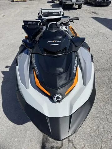 Slide: The Image of 2025 Sea-Doo FISH PRO jet ski parked outdoors. - 4