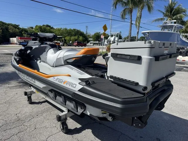 Slide: The Image of 2025 Sea-Doo FISH PRO jet ski with cooler on trailer. - 7