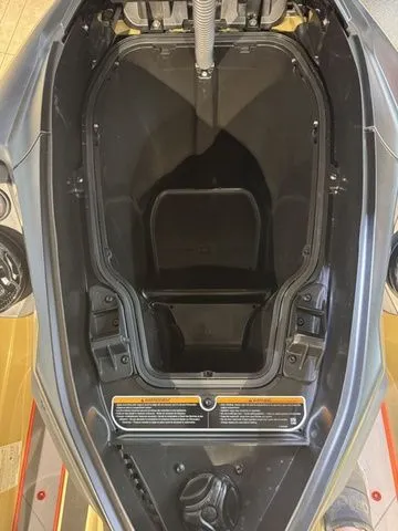 Slide: The Image of Interior of a 2025 Sea-Doo RXT-X jet ski, storage compartment view. - 15