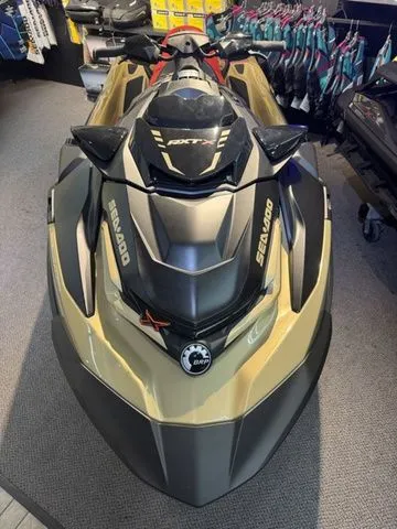 Slide: The Image of 2025 Sea-Doo RXT-X jet ski displayed in a showroom. - 3