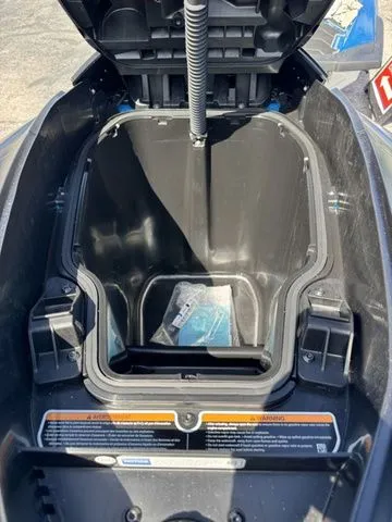 Slide: The Image of Open storage compartment of a 2026 Sea-Doo RXT-X jet ski. - 13