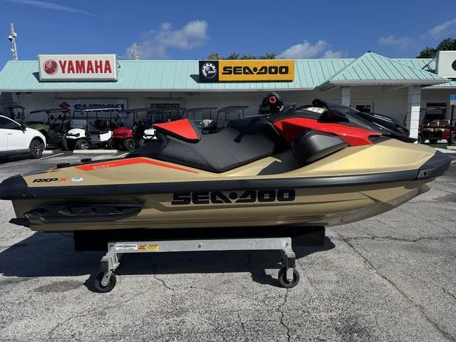 The Image of 2025 Sea-Doo RXP-X 325 jet ski in front of dealership. - 1