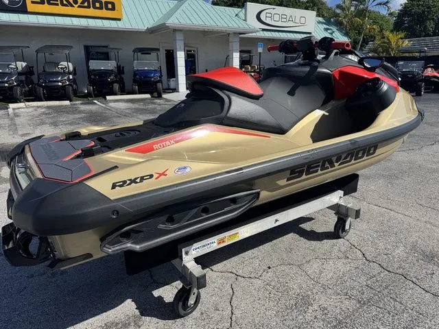 Slide: The Image of 2025 Sea-Doo RXP-X 325 jet ski on a trailer outdoors. - 8