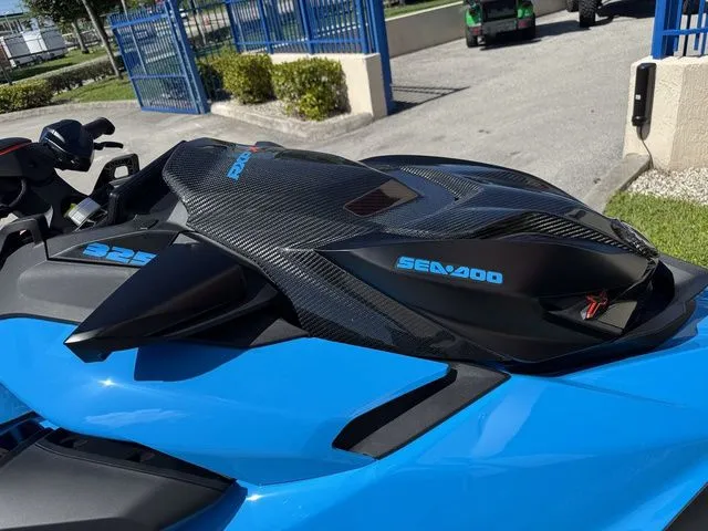 Slide: The Image of 2026 Sea-Doo RXP-X 325 in Gulfstream Blue, close-up view. - 11