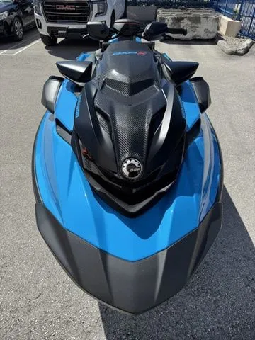 Slide: The Image of 2026 Sea-Doo RXP-X 325 in Gulfstream Blue on parking lot. - 3