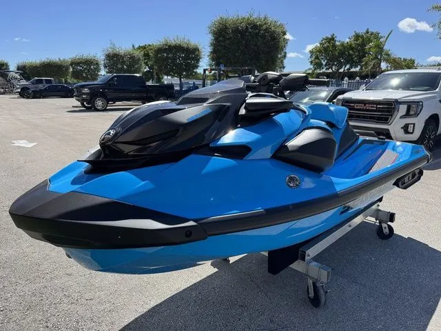 Slide: The Image of 2026 Sea-Doo RXP-X 325 jet ski in Gulfstream Blue on parking lot. - 4